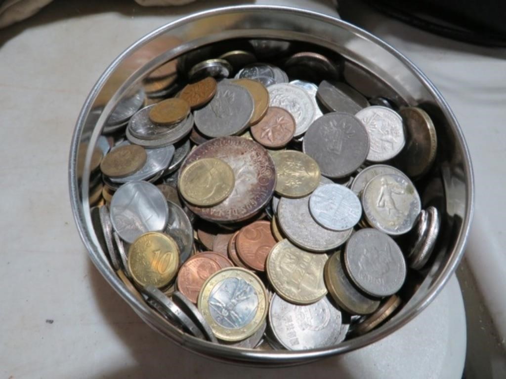 TIN OF FOREIGN COINS