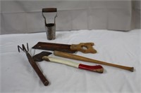 Bulb digger, mitre box saw, garden rake, hatchet