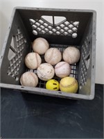 Plastic crate with softballs