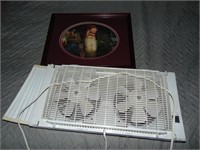 Window Fan and Framed Santa Claus Picture