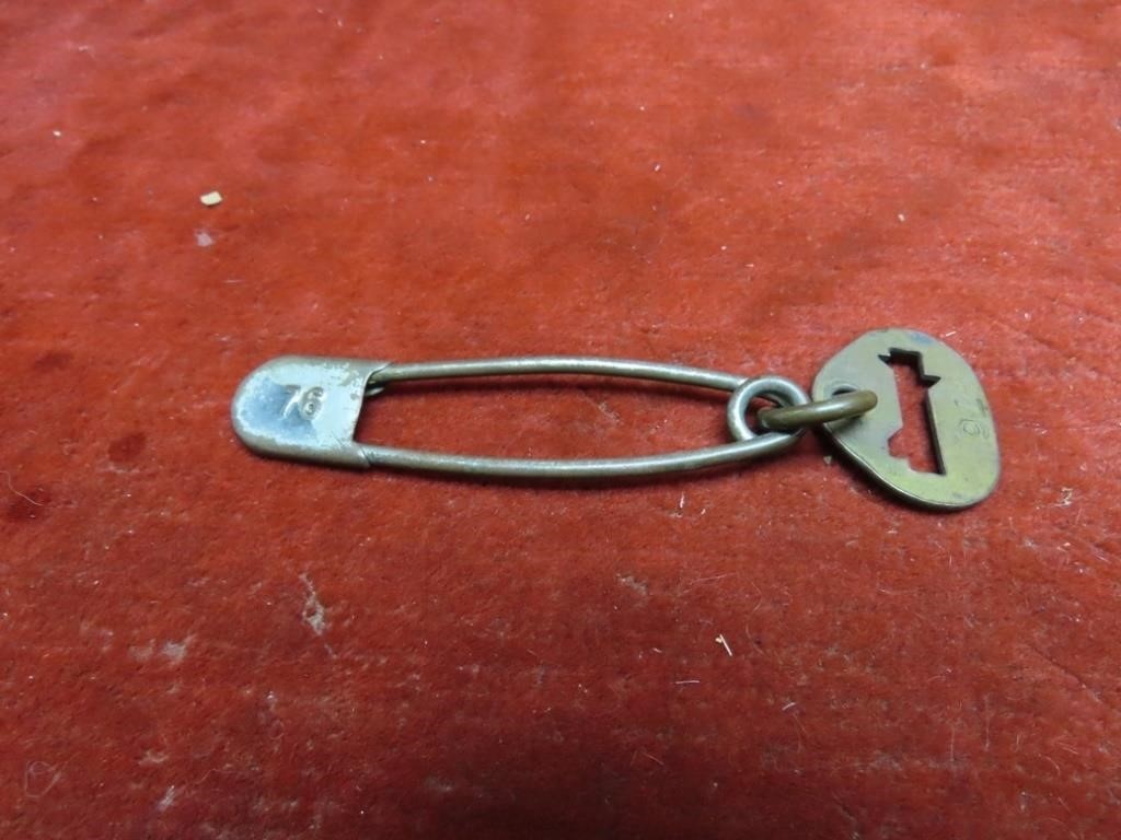 Vintage brass #76 laundry pin & number tag.