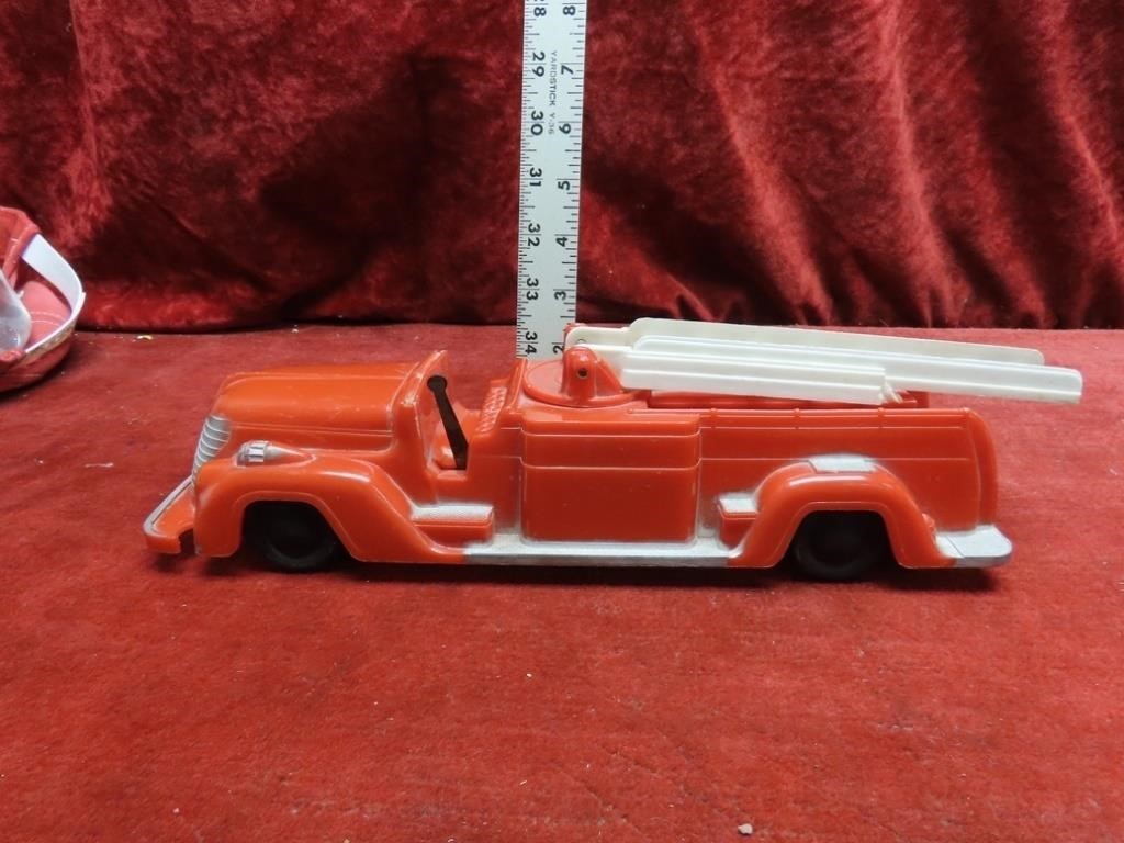 Vintage Saunders plastic wind up fire truck.