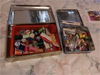 2 metal tins of sewing items, a few buttons.