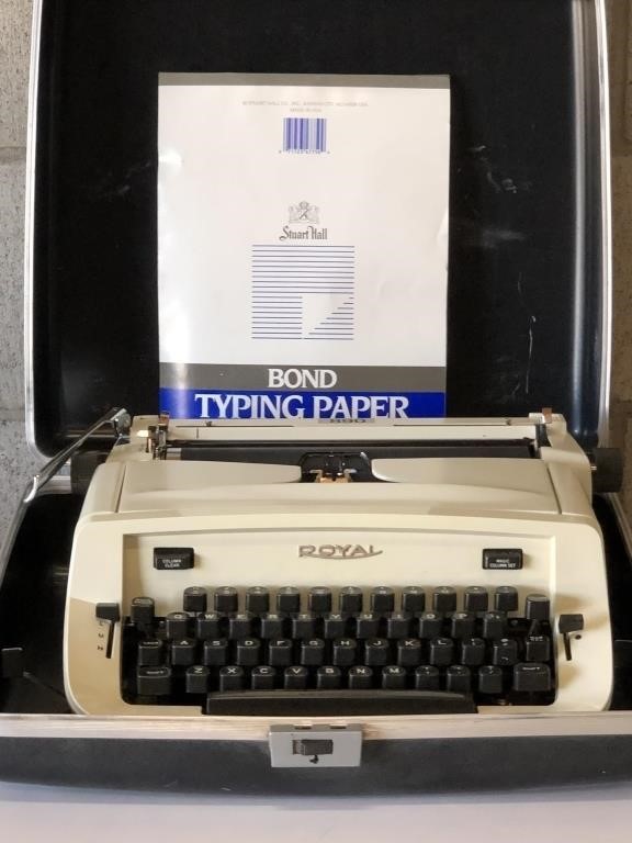 Vintage Royal Typewriter in case with paper