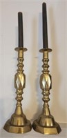 Pair of metal candle holders and candles