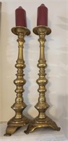 Pair of metal candle holders and candles