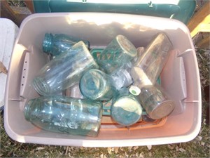 green canning jars and zinc lids in tote
