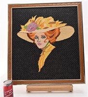 Petit point femme au chapeau, encadré,