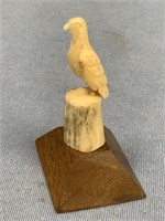 Core ivory carving of an eagle on antler and wood
