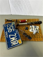 Old license plate, hunting knife, misc