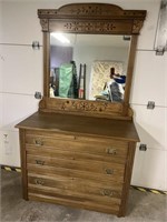 Antique dresser with spoon carved mirror