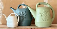 Three Plastic Watering Cans