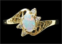 14K Yellow gold cabochon opal ring with round