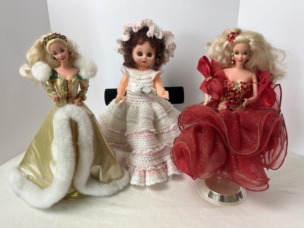 Pair of Holiday Barbies and plastic baby doll