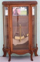 LATE VICTORIAN OAK CURVED GLASS CHINA CLOSET,