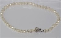 White pearls (approx 8mm) with silver clasp