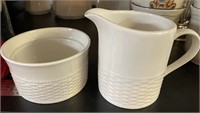 One Oneida Wicker Cup and Cream Pitcher K