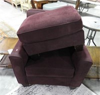 Plum colored upholstered lounge chair and mat