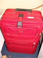 One (1) Piece of Red Luggage