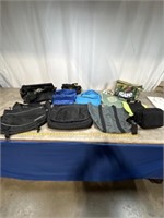 Assortment of bags including backpack, laptop