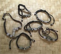 6 Bracelets With White Stones on Woven Cords
