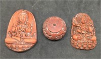 3 Carved Red Pendants
