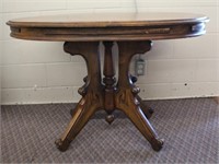 Single pedestal, four carved legs table, 43.5 X