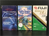 Three sealed assorted VHS tapes
