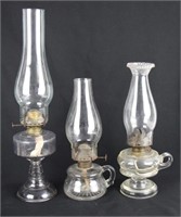 THREE ANTIQUE GLASS OIL LAMPS