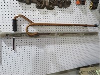 COLLECTION OF WALKING CANES & EARLY WOOD LEVEL