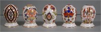 Five Royal Crown Derby eggs on stand