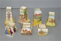 Seven various Royal Doulton posy vases