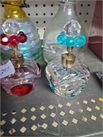 2 perfume bottles and 2 bee Hive bottles