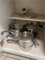 Pots and skillet (left side of cabinet)