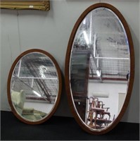 Two vintage wood framed wall mirrors