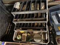 tacklebox with assorted lures and bobber