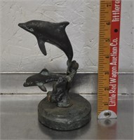 Brass dolphins figure, marble base
