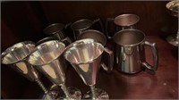 6 silver plated mugs and 3 water goblets