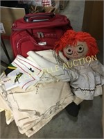 Luggage, linens and raggedy Ann doll
