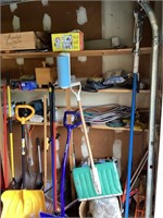 Long handled tools & shelf contents in garage