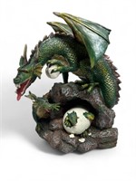 Green dragon with babies hatching egg sculpture