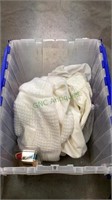 Closable tub contains vintage baby clothing and