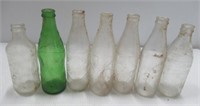 Glass pop bottle collection includes Coca-Cola,