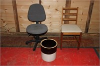 rolling office chair with 5 gal crock with crack