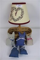 Basket with attached lamp and sewn cats