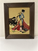 Framed vintage needlepoint matador artwork