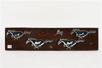 FORD MUSTANG CAR BADGES MOUNTED ON WOODEN BOARD