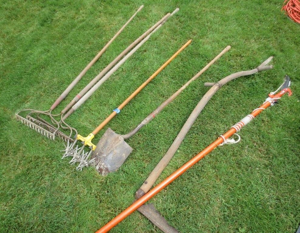 Garden rakes, shovel, limb cutter, misc