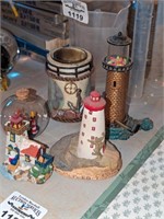 Lighthouse figures, ship in glass ball, etc