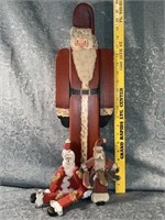 (D) 22 inch tall wooden Santa with two smaller